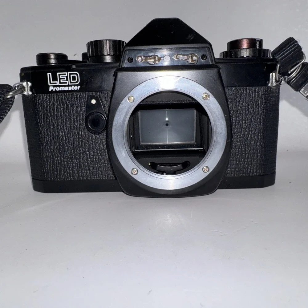 Chinon LED Promaster 35mm SLR Film Camera with Two Lenses and A Flash Untested